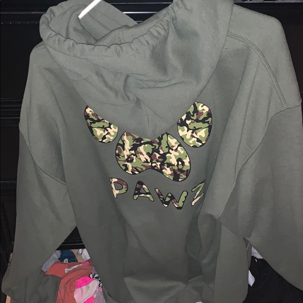Pawz green sweatshirt.